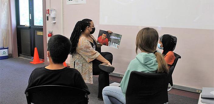 a BSU student reads to elementary school children on Hanscom Air Force base in Massachusetts